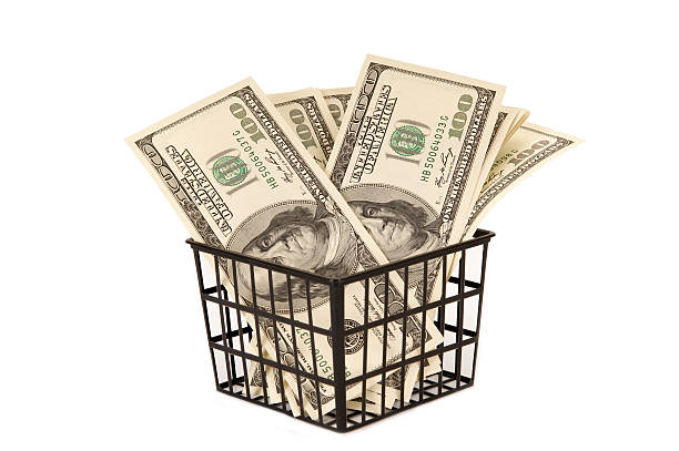 istock Hundred dollar bills money in the basket 464386235
