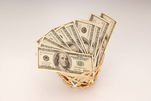 istock Hundred dollar bills money in the basket 464386443