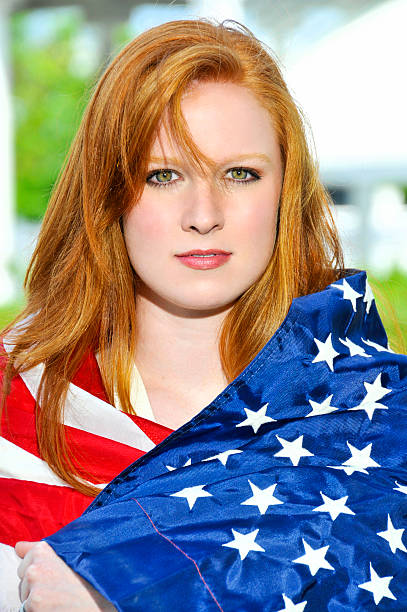istock Woman Wrapped in a Flag 464387655