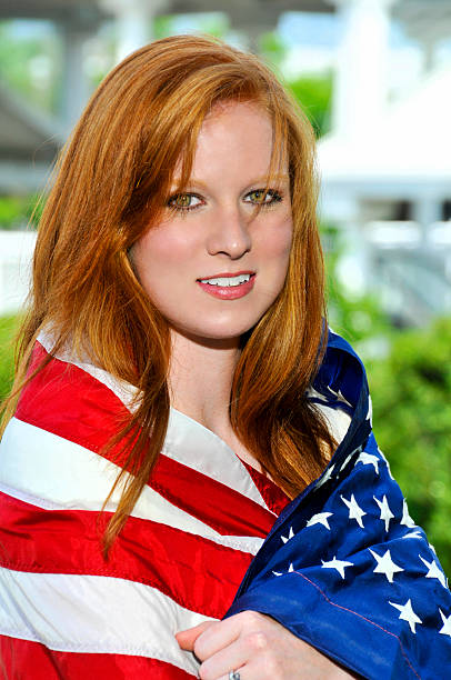 istock Woman Wrapped in a Flag 464387665