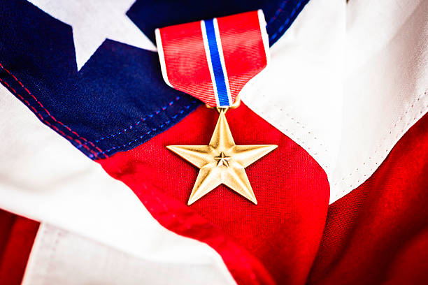 istock Military Bronze Star Medal on American Flag 464388301