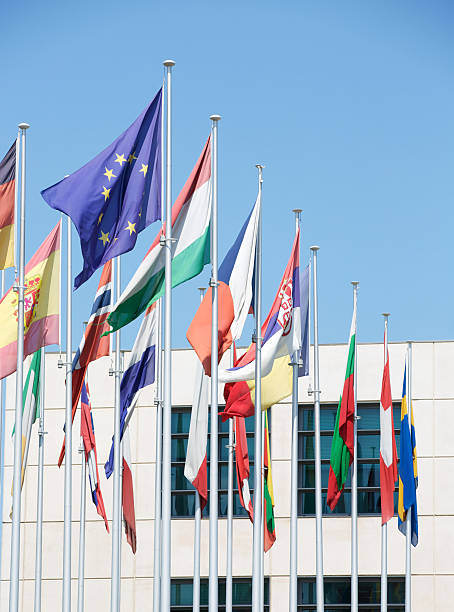 istock European flags against a backdrop of building and sky. 464389323