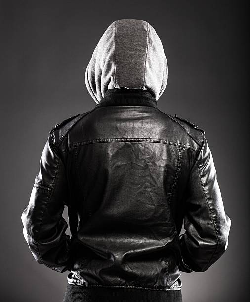 istock Young man in leather jacket and hood rear view 464391561
