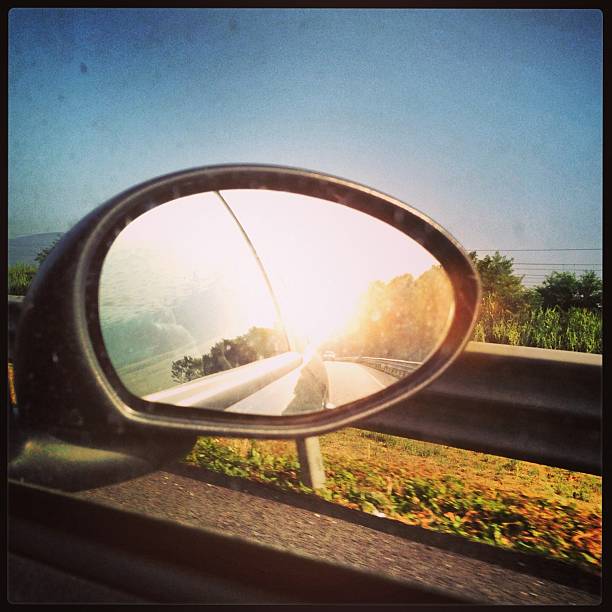 Beautiful landscape from car window on mountain road. Summer traveling by car