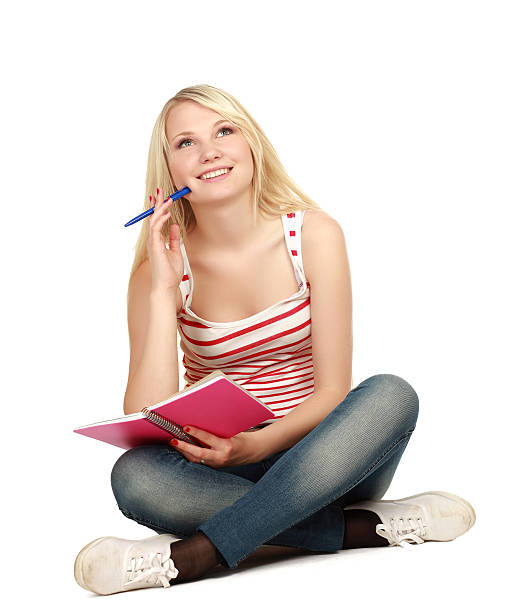 istock Happy female student sitting on floor 464393619