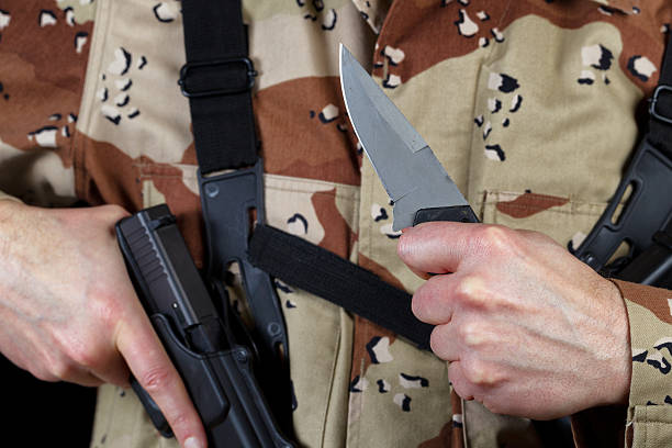 istock Soldier holding knife in ready position 464394242