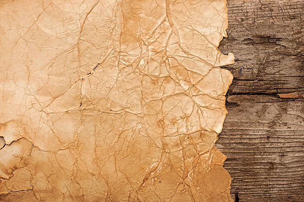istock Grunge paper on wooden wall background 464398337