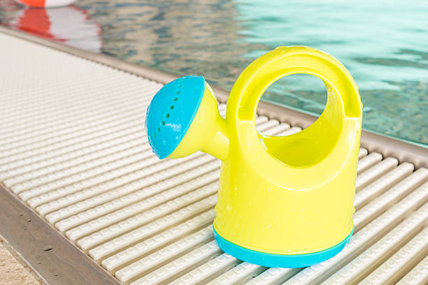 istock watering can on a border of an indoor rustless baby 464401328