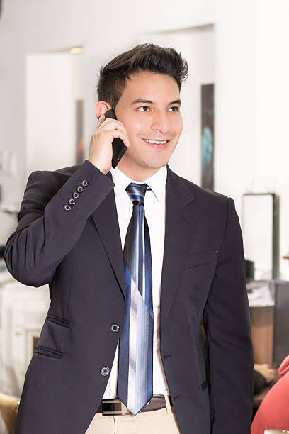 exitoso hombre de negocios joven hispana - male vertical photography studio shot fotografías e imágenes de stock