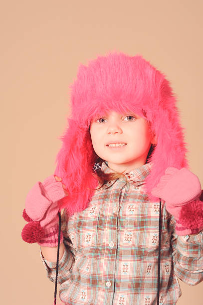 istock Stylish young model wearing fur hat 464401779