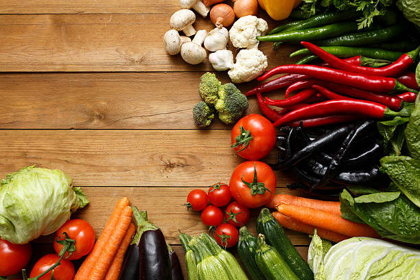 istock Healthy Organic Vegetables on a Wooden Background 464401890