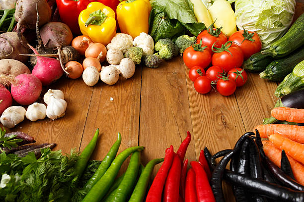 istock Healthy Organic Vegetables on a Wooden Background 464401894