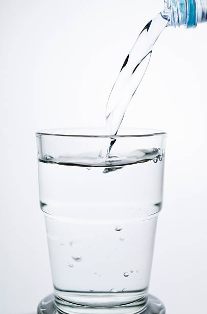 istock Filling a glass with water 464402117