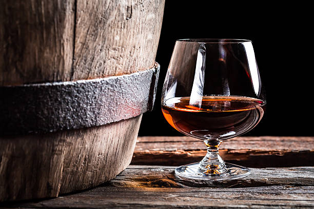 istock Brendy glass and old oak barrel 464402632