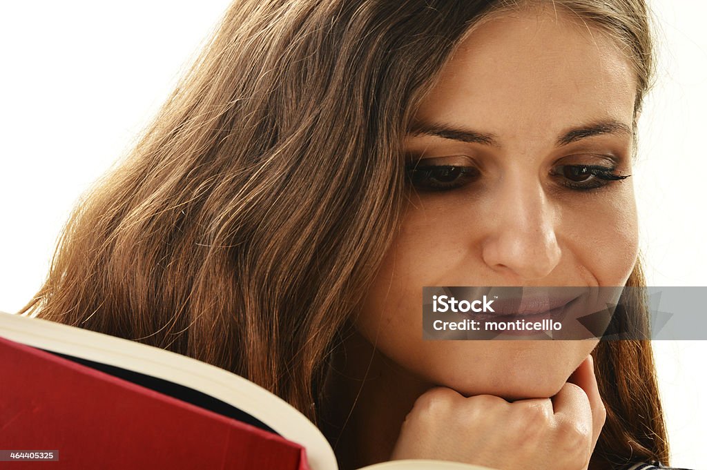 Young woman reading a book isolated on white Young woman reading a book isolated on white. Female student learning Adult Stock Photo