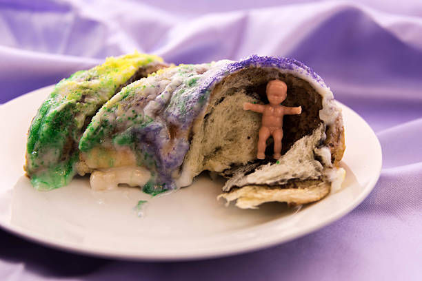 istock Mardi Gras King Cake with baby 464405448
