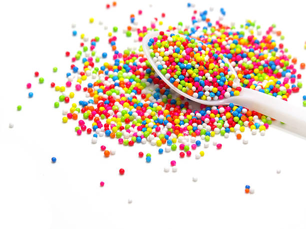 istock colorful sugar pearls in white spoon 464405482