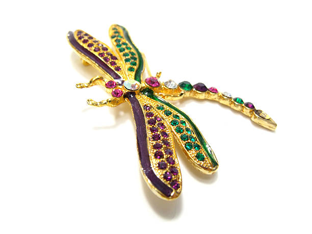 istock beautiful golden brooch with precious stones isolated on white 464405564