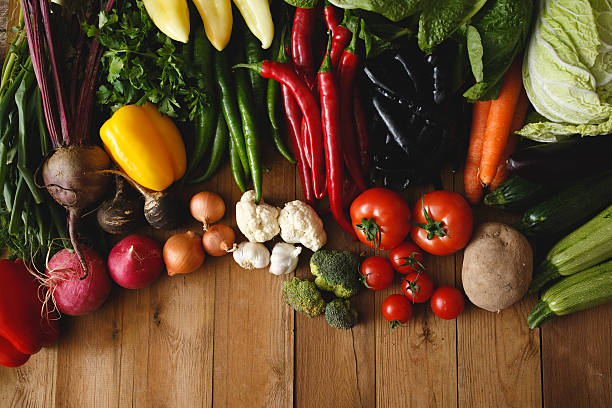 istock Healthy Organic Vegetables on a Wooden Background 464405984