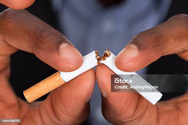 Breaking A Cigarette Stock Photo - Download Image Now - Quitting Smoking, Cigarette, Smoking Issues