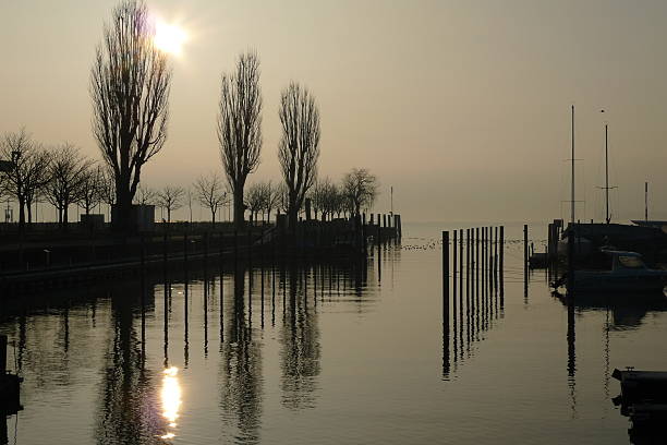 istock Sunrise in small port 464406583