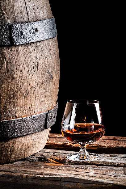 istock Glass of cognac in the old cellar 464406600