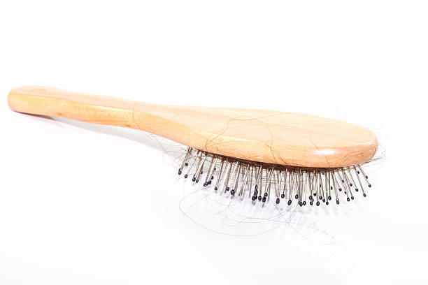 istock Hair Loss with comb on white background 464407572