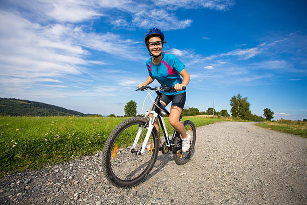 Small boy riding a bike with beautiful sunshine