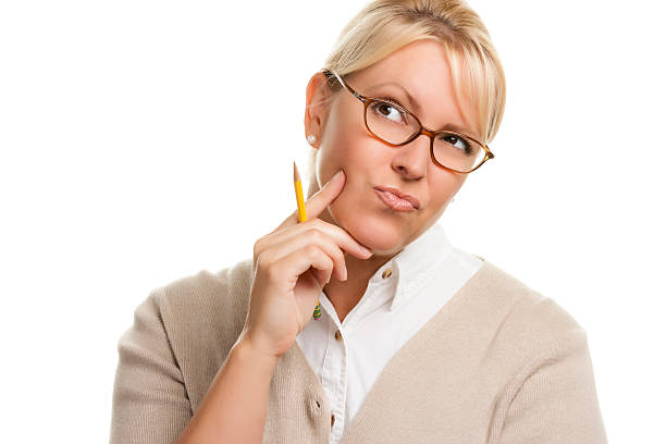 istock Thinking Woman with Pencil Looking Up and to the Left 464407708