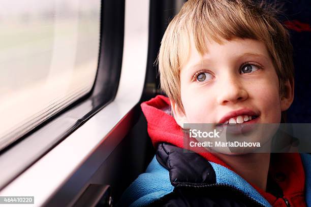 Cute Boy Looking Through The Window Stock Photo - Download Image Now - Autism, Child, Train - Vehicle