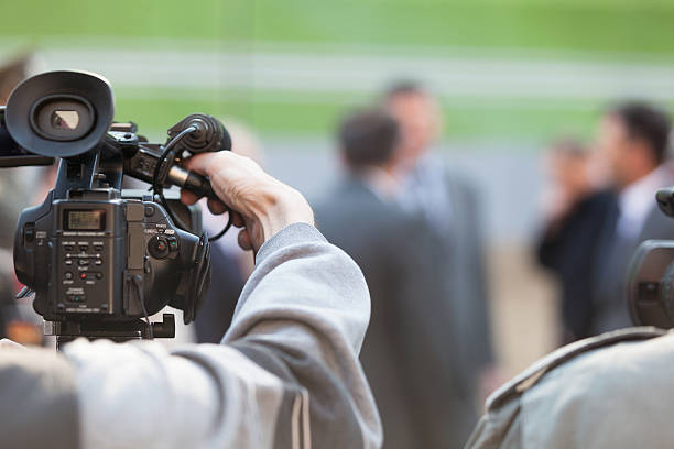 istock Filming an event with a video camera 464411176