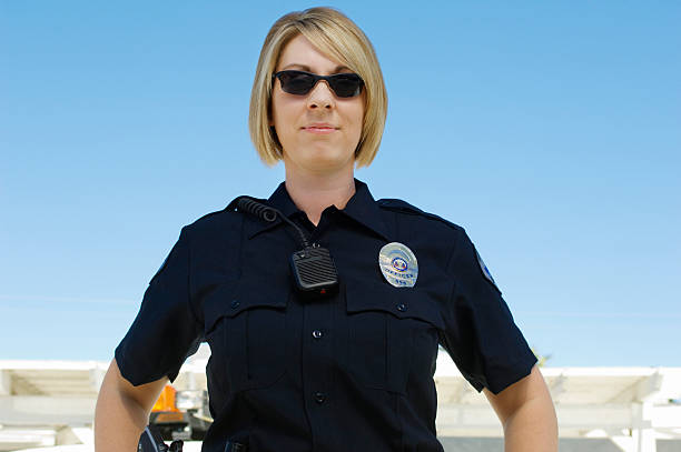 istock Female Police Officer Standing 464411586