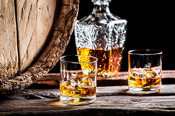 istock Two glasses of good whisky with ice 464411808