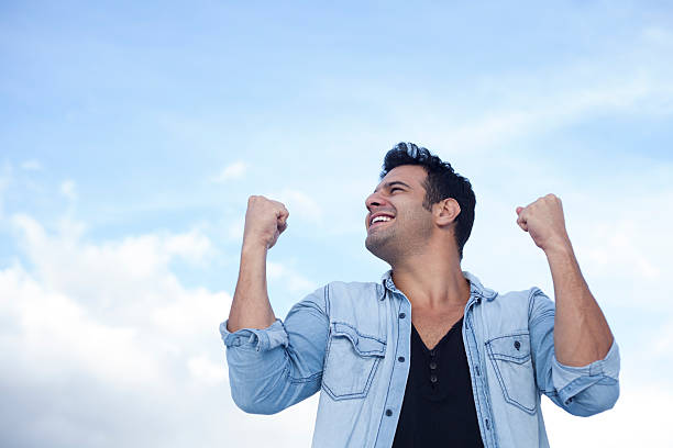 istock Man raising his hands to the sky 464412212