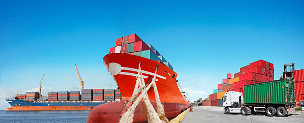istock Cargo truck and ships in the port 464412547