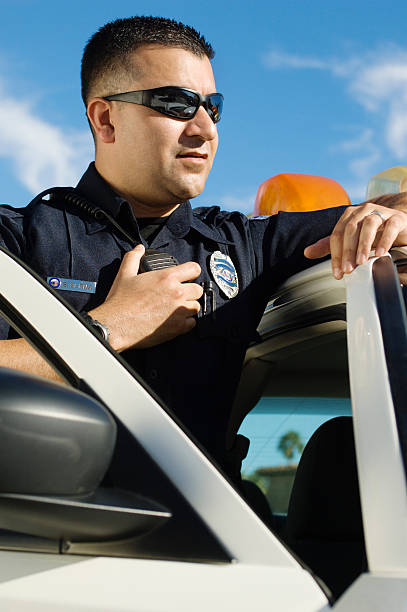 istock Male Officer Holding Walkie-Talkie 464415936