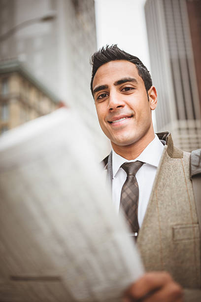 istock business man reading a newspaper on manhattan 464416673