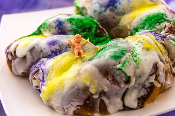 istock Mardi Gras King Cake with baby 464419926
