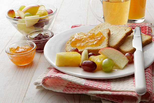 istock Breakfast: Toast, Fruit Salad, Orange Juice and Tea 464423792