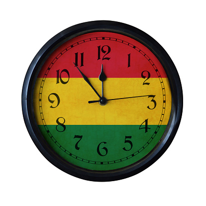 An old Bolivia flag wall clock with grungy background - isolated over white