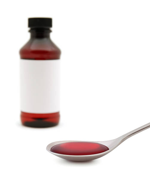 remédio para a tosse - cough medicine spoon medicine tablespoon imagens e fotografias de stock