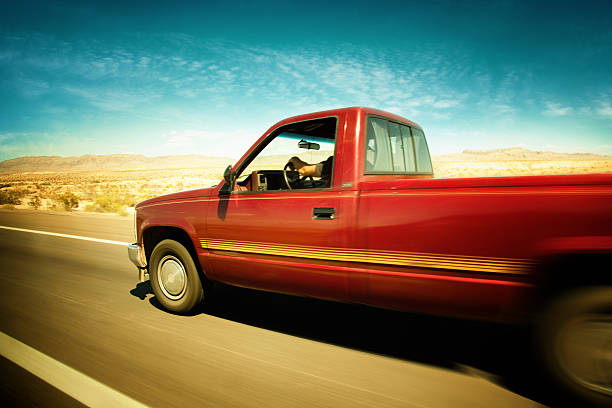 istock speeding with semi truck on desert road 464425360