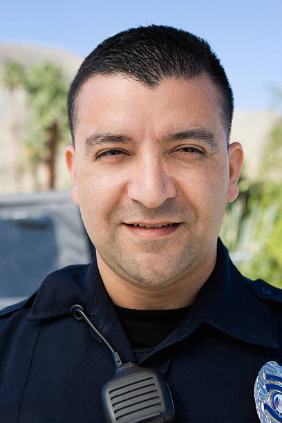 istock Male Police Officer Smiling 464425612