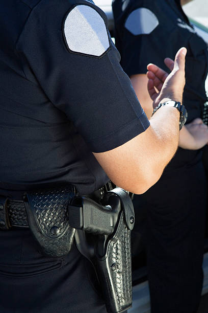 istock Male Police Officer Gesturing 464430574