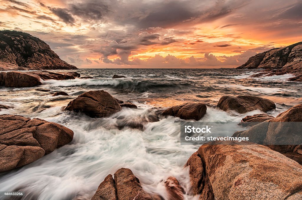 coastline morning A dramatic scene of rocky shore with flowing water when dawn. Photo taken in Shek O, Hong Kong. 2015 Stock Photo