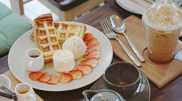 istock Waffle serving with ice cream and strawberry 464433636
