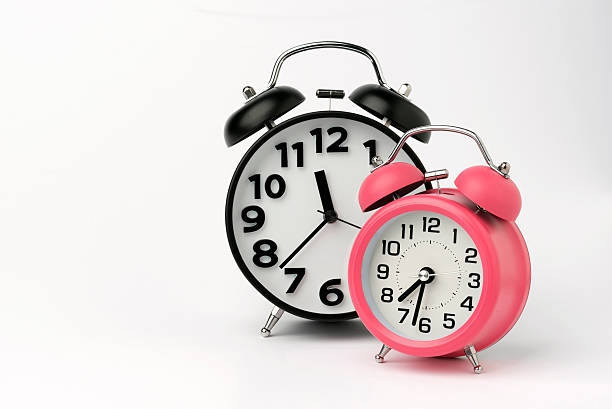 istock Black and Pink Table Alarm Clock on White Background 464436144