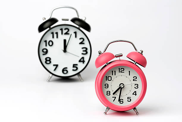 istock Black and Pink Table Alarm Clock on White Background 464436172