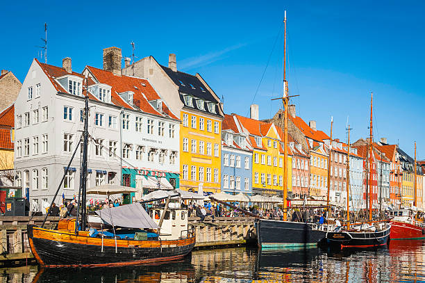 istock Copenhagen crowded waterfront colourful bars restaurants at Nyhavn Denmark 464438576
