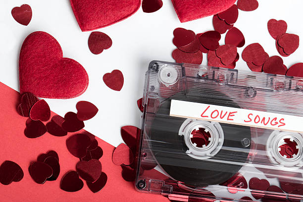 istock Audio cassette tape on red backgound with fabric heart 464441838